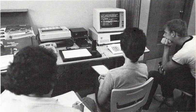 a black and white photo from 1986 of high school ap calculus students attending a class taught via computer by college professor Tom Tucker