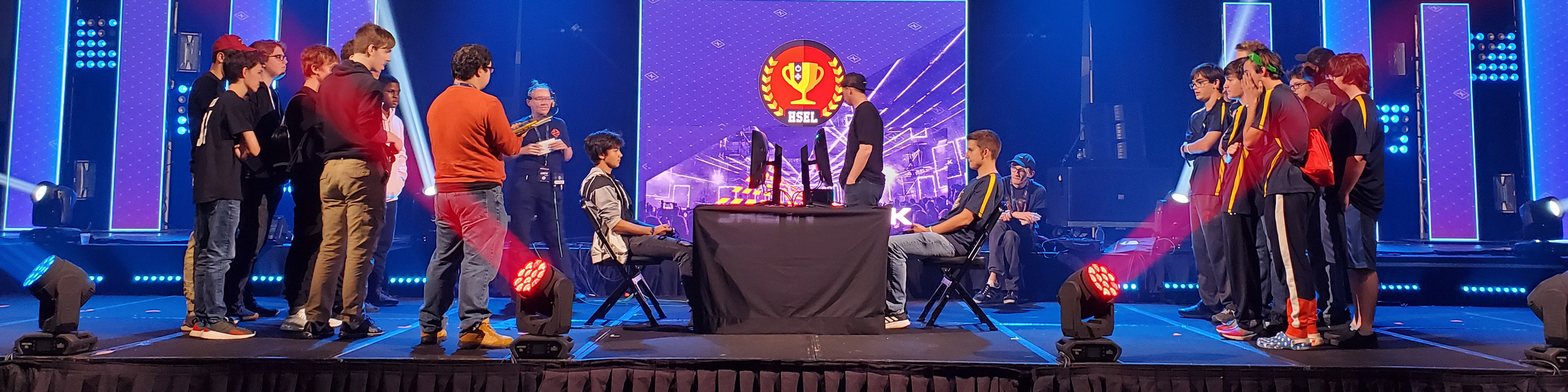 two teams of all male high school e sports gamers compete on a stage