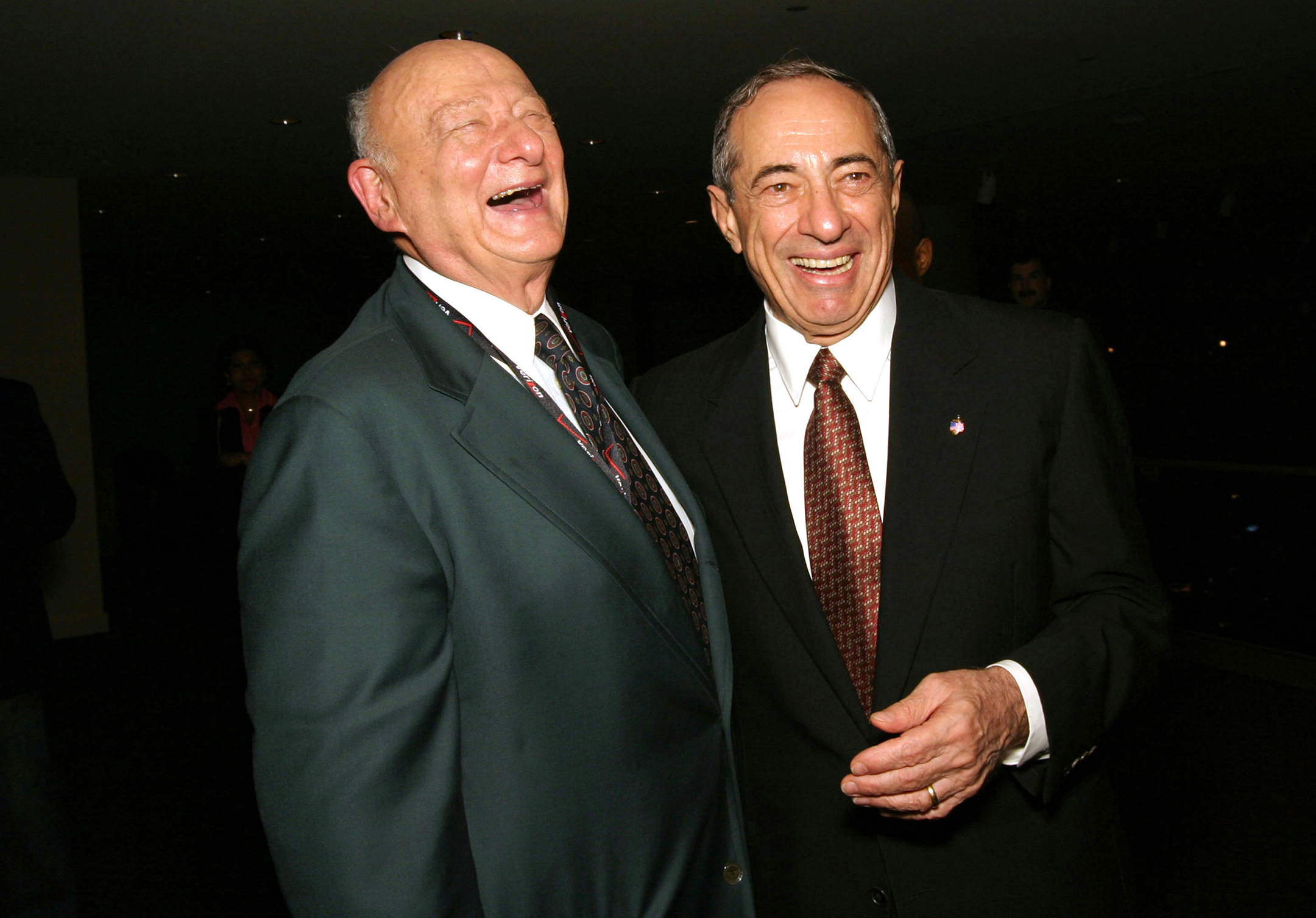 photo of former new york city mayor ed koch (left) laughing as he stands next to a smiling mario cuomo