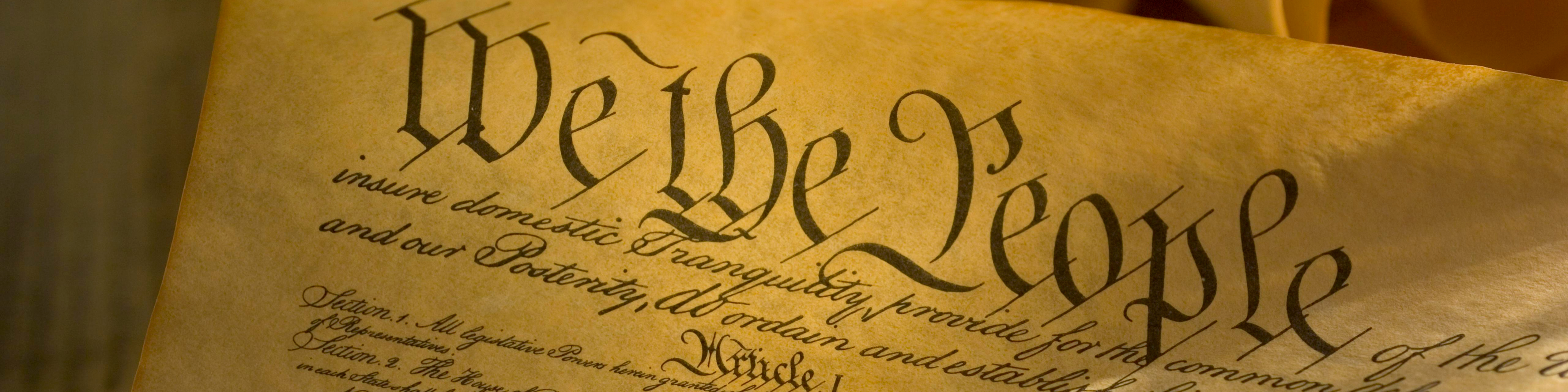 close up of united states constitution with the words we the people visible