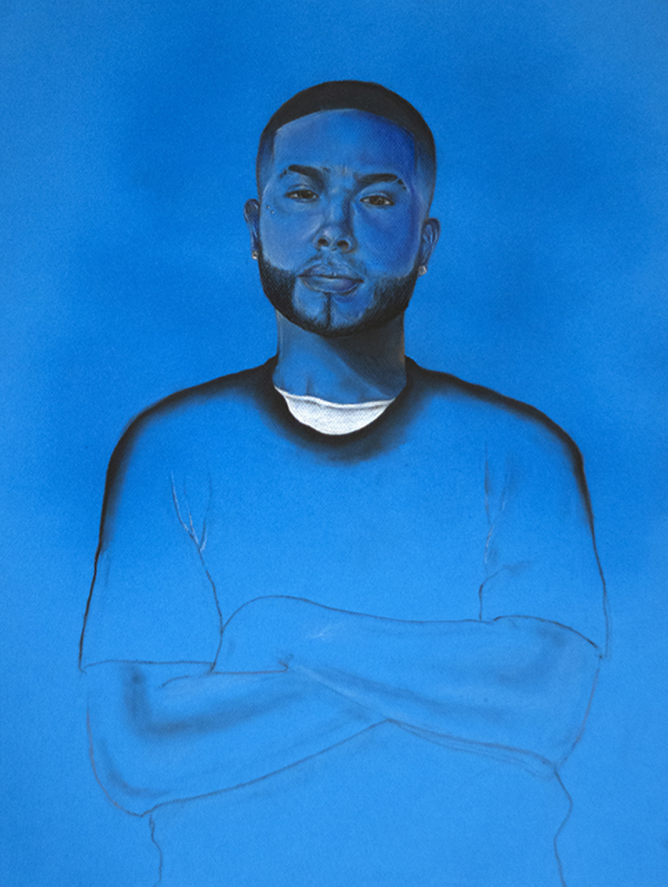 portrait of a young black man, from the waist up, his arms folded, on a blue background