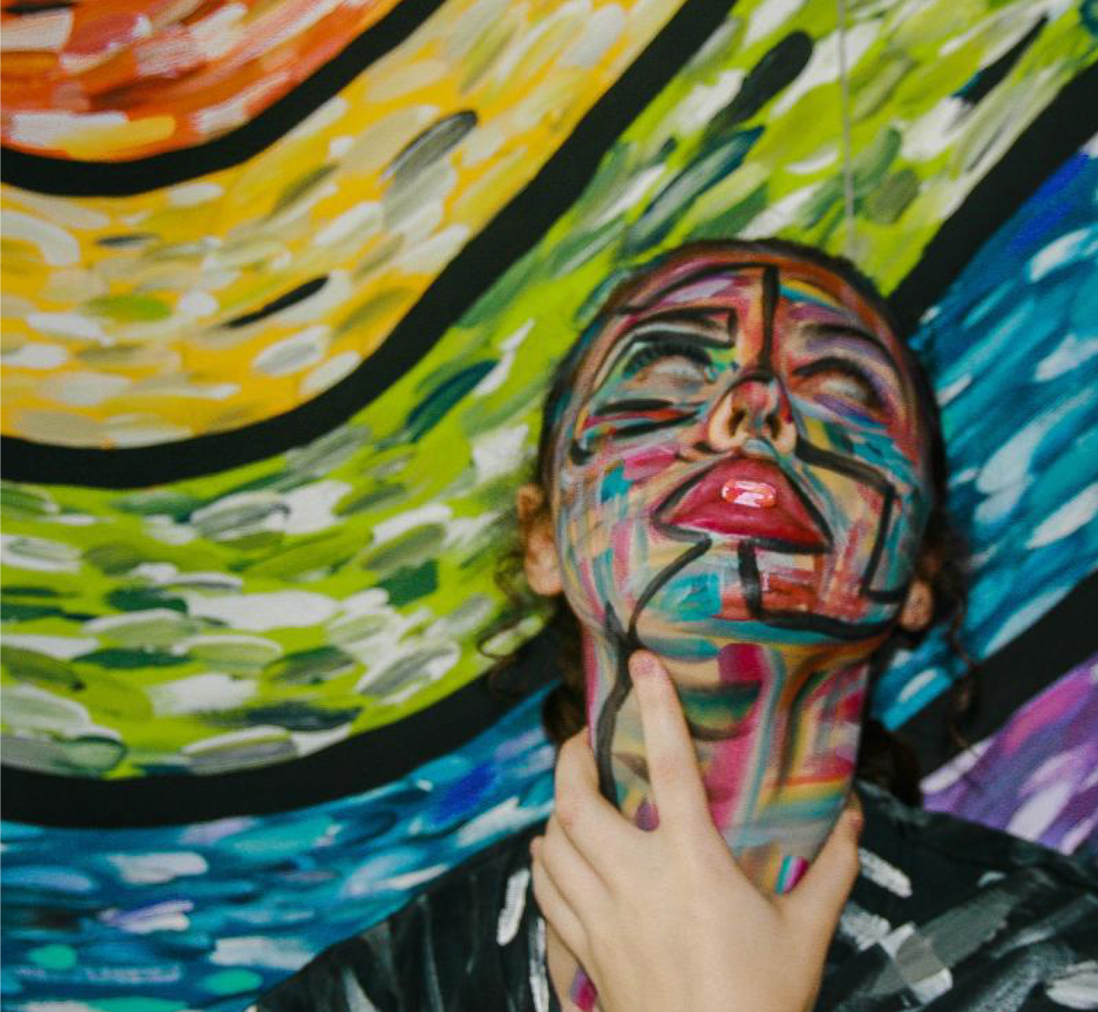Image of a young woman with paint on her face, looking up and clutch her throat, against a Van Gogh like background in red, yellow, green, blue, and purple arcs
