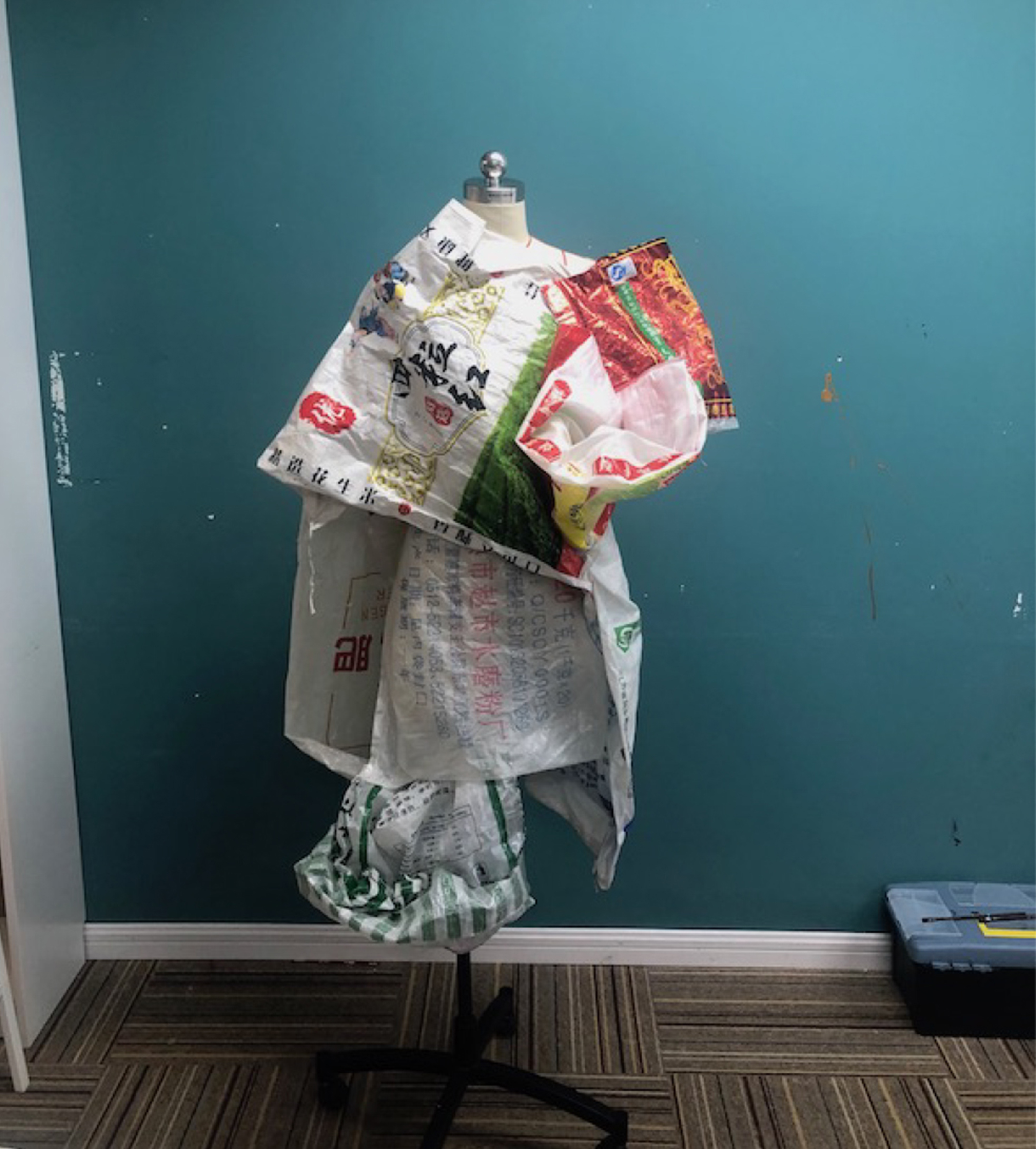 Photo of a dress made from bags with Chinese characters 