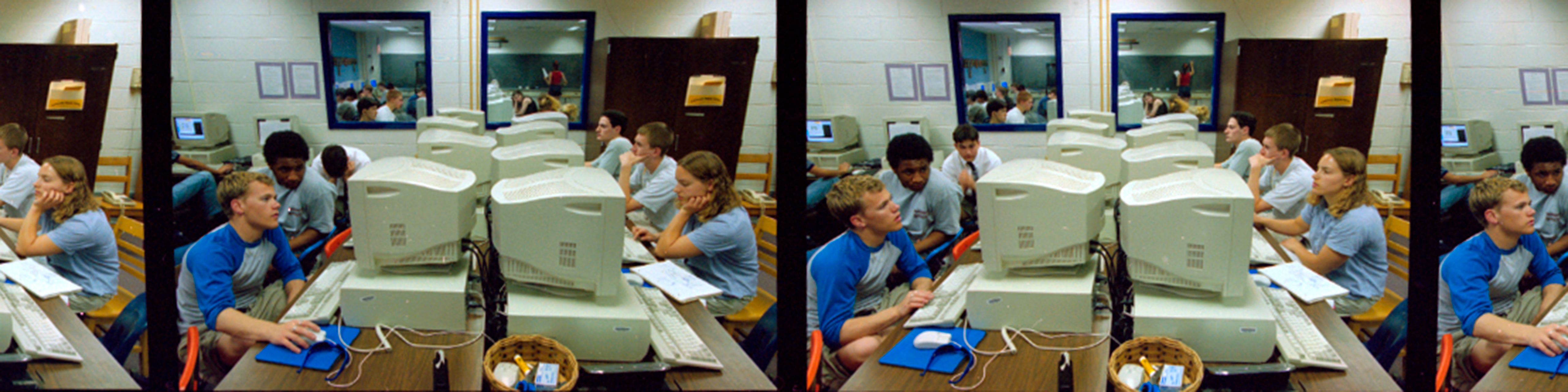 Three color photographs on a film strip showing male high school students working at computers
