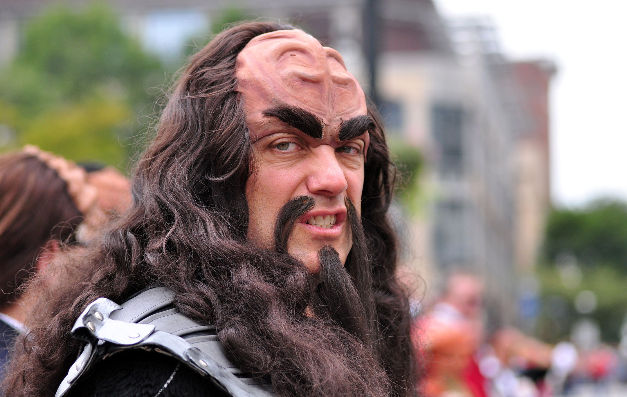 Man dressed up as a Klingon sneering at the camera