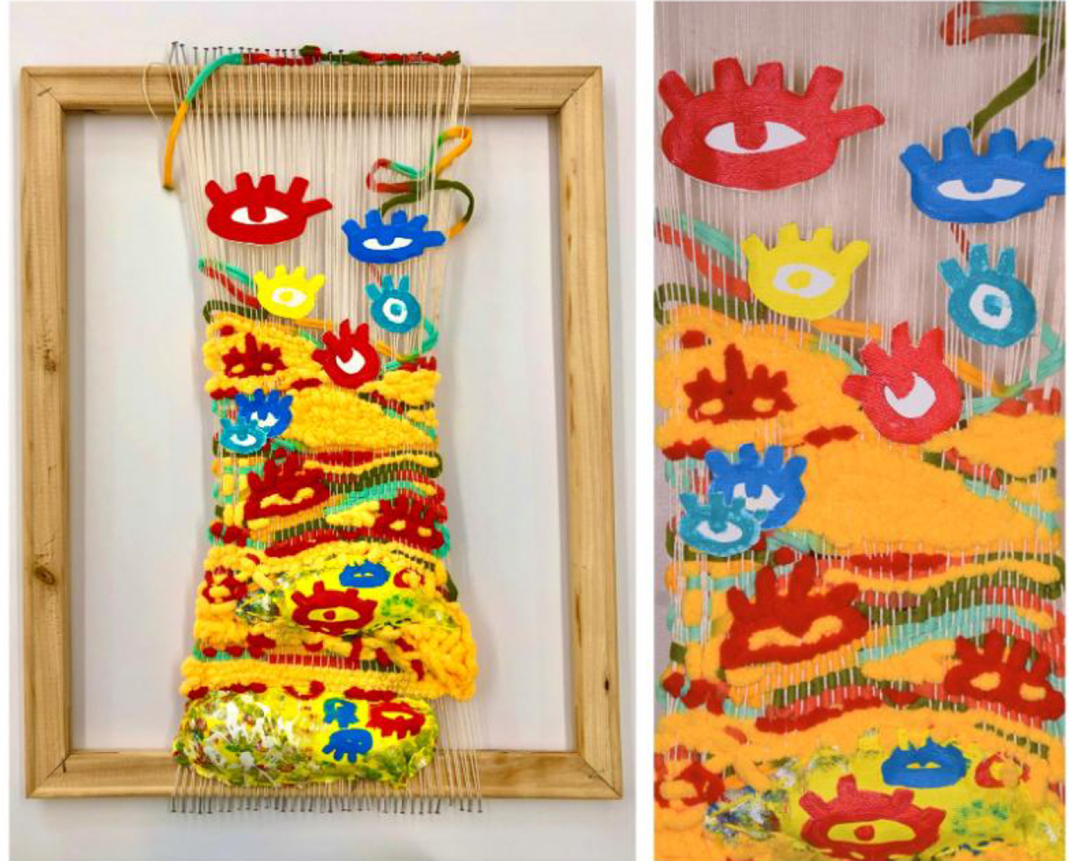 An empty wood picture frame with a fiber art sculpture of yellow fabric and blue and red eye-like items hung in it