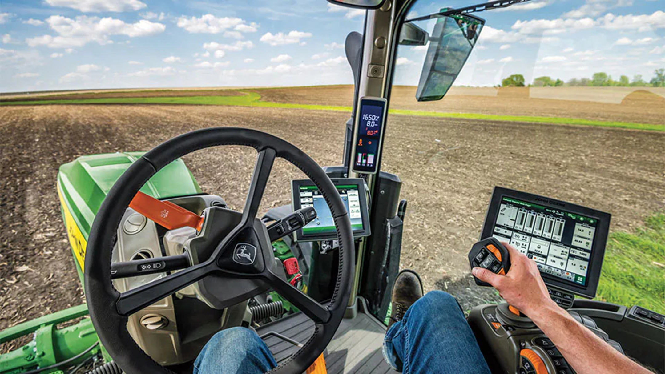 View from inside a tractor showing the computer equipment farmers interact with when using the vehicle