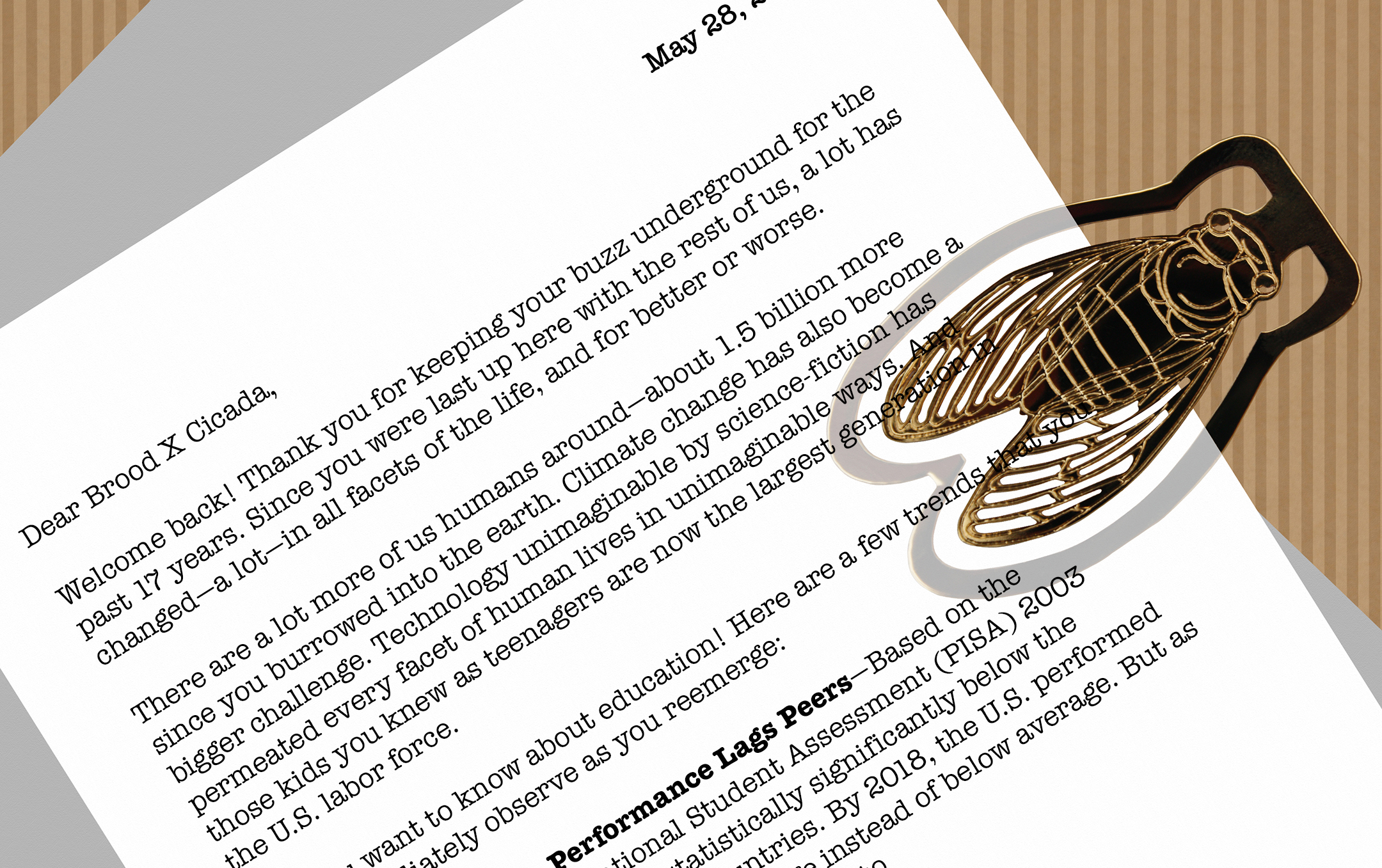 Pages of a letter linked to a paper clip in the shape of a golden cicada