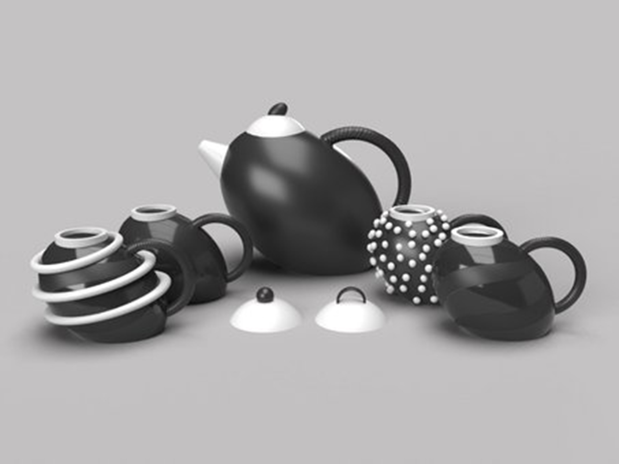Photo of a five-piece tea set in black, white, and gray