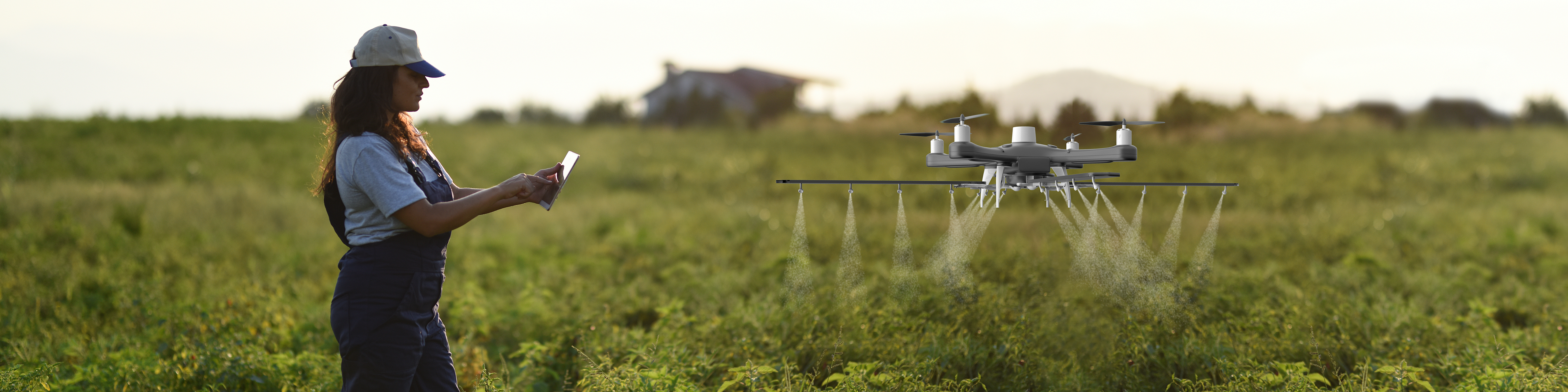 Young female farmer operating smart-farming drone