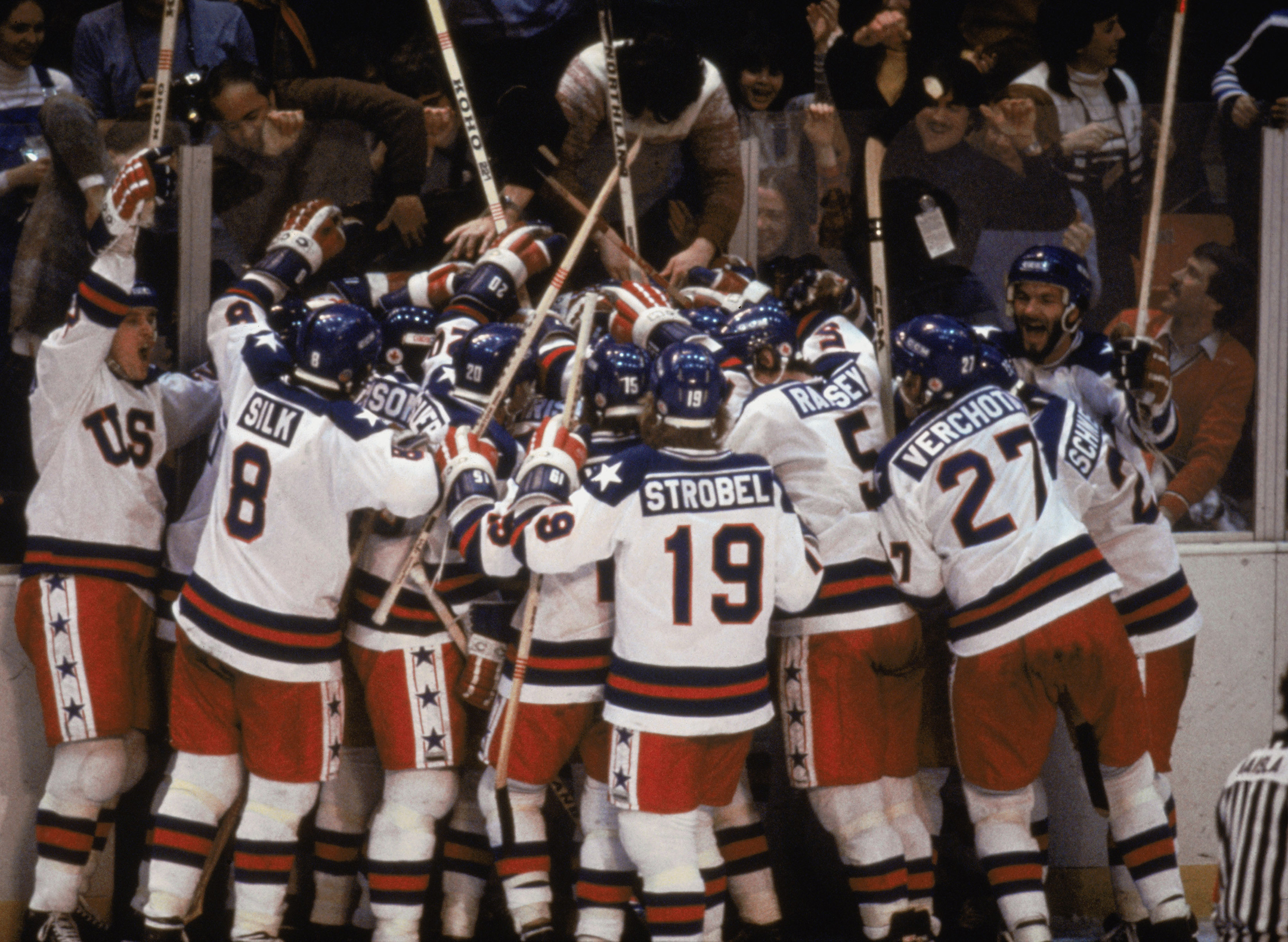 US ice hockey team celebrating defeating the USSR in the 1980 winter Olympics