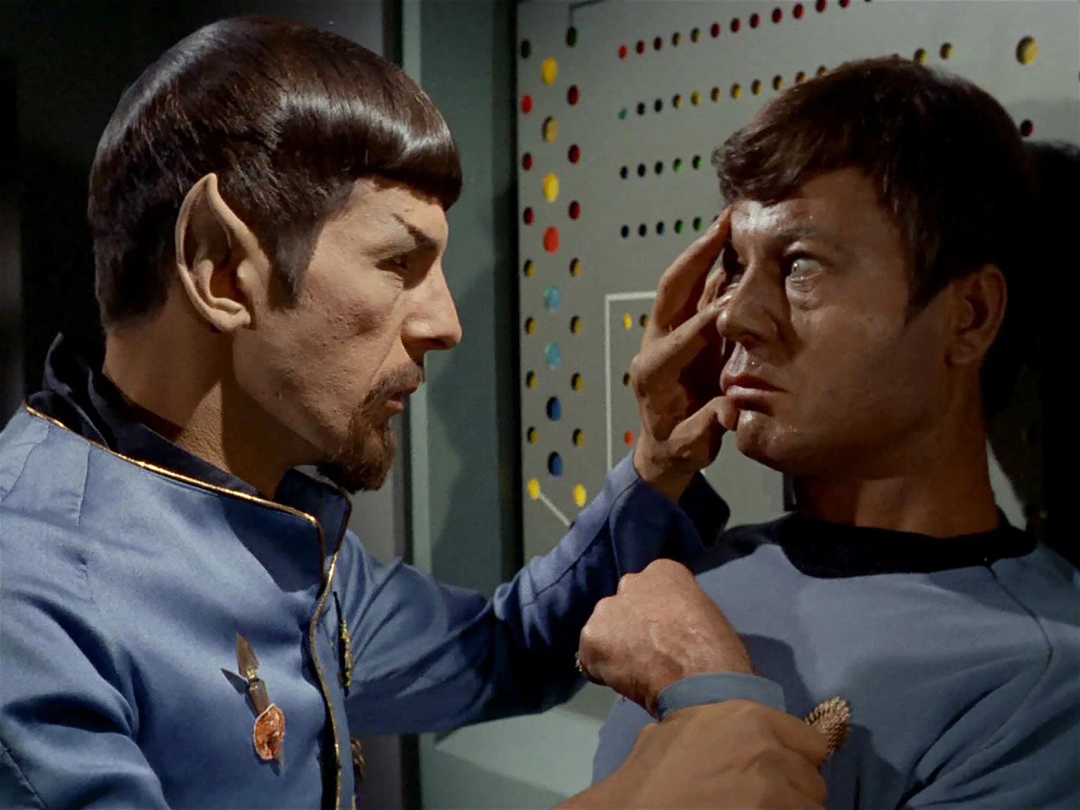 A bearded Spock performing a Vulcan mind meld on Dr. McCoy in Star Trek