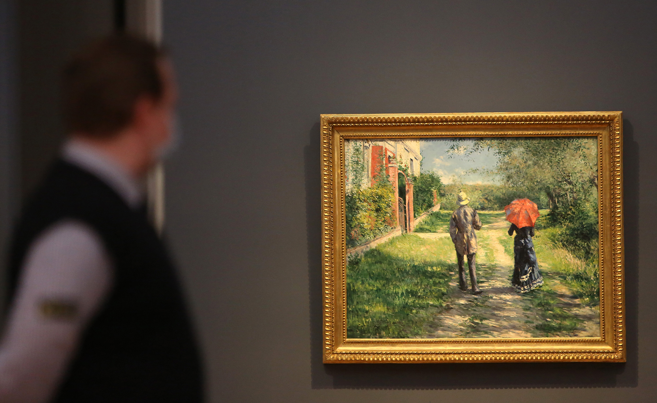 A security guard looks at a painting at Museum Barberini in Potsdam, Germany.
