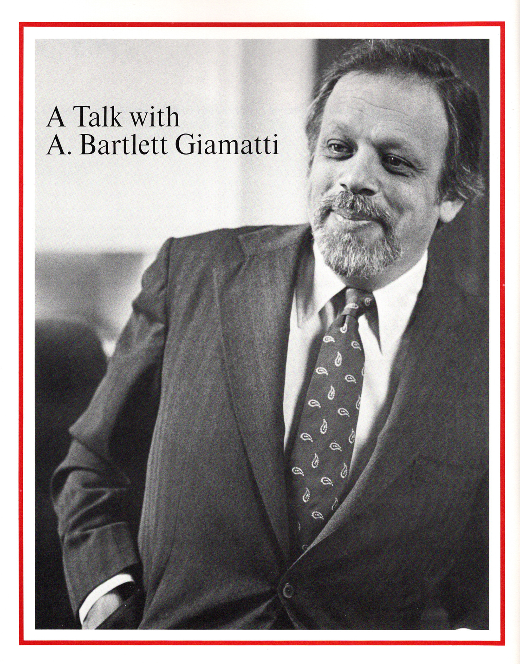 Black and white photo of a grinning A. Bartlett Giamatti with the words "A Talk With A. Bartlett Giamatti" at the top left