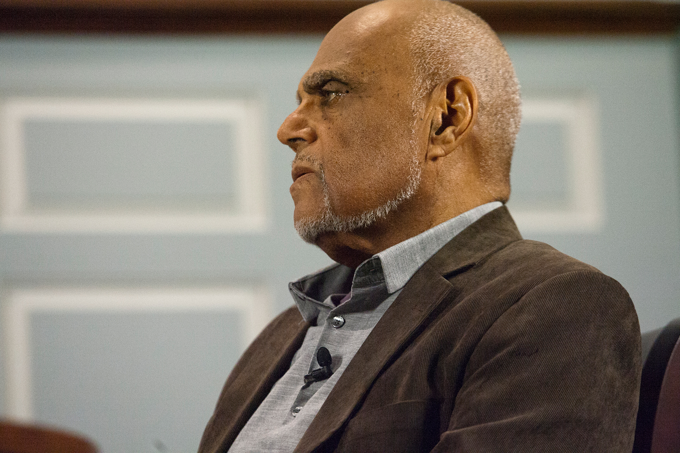 Photo showing Bob Moses seated, in profile looking left