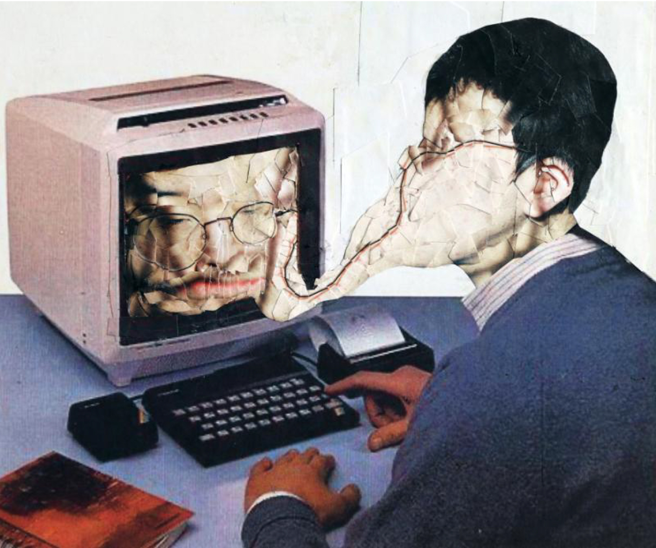 Young man sitting in front of an old desktop computer with his face getting sucked into the screen
