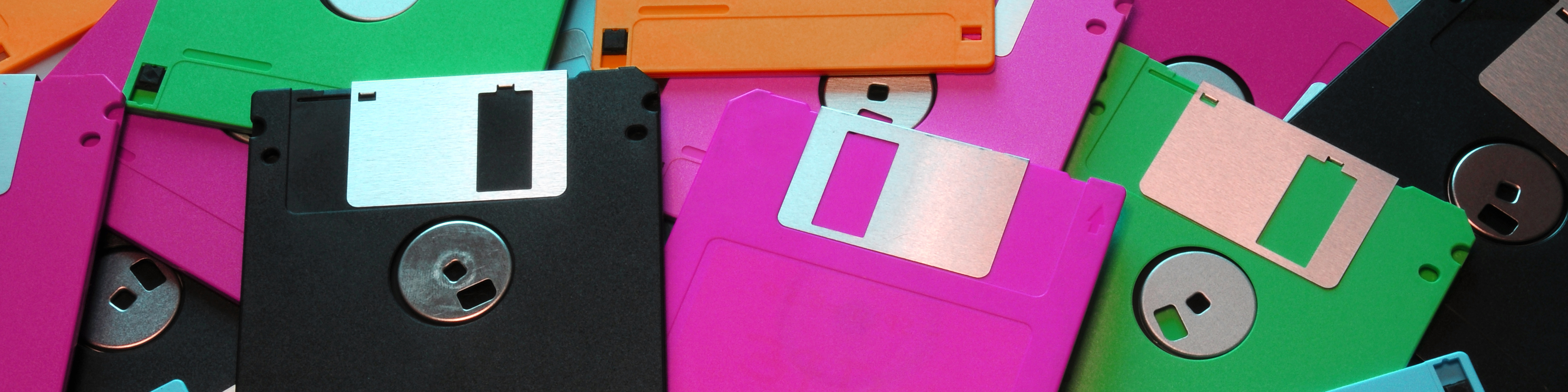 Pile of floppy disks in various colors