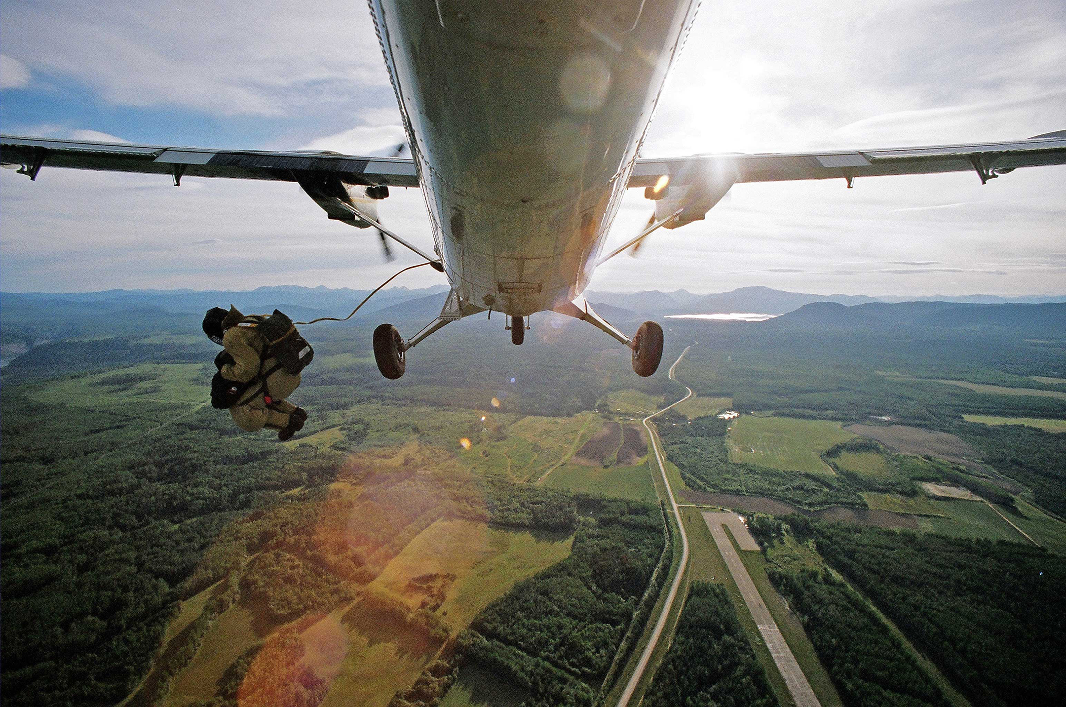 Firefighter parachuting out of an airplane