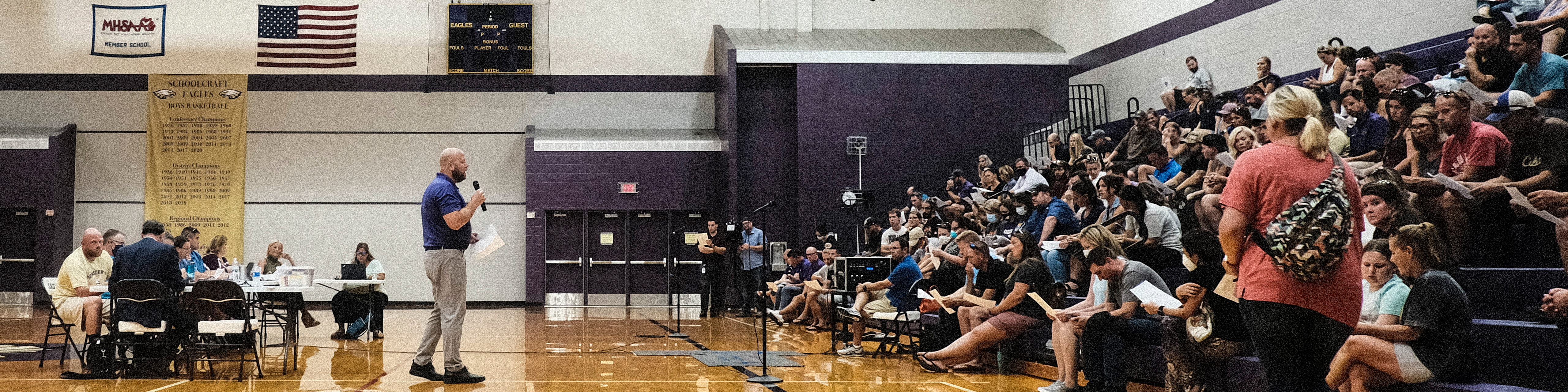 People attend a special Board of Education Meeting on mask mandates for students and staff in Kalamazoo County Schools at the Schoolcraft High School Gymnasium on August 23, 2021 in Schoolcraft, Michigan.