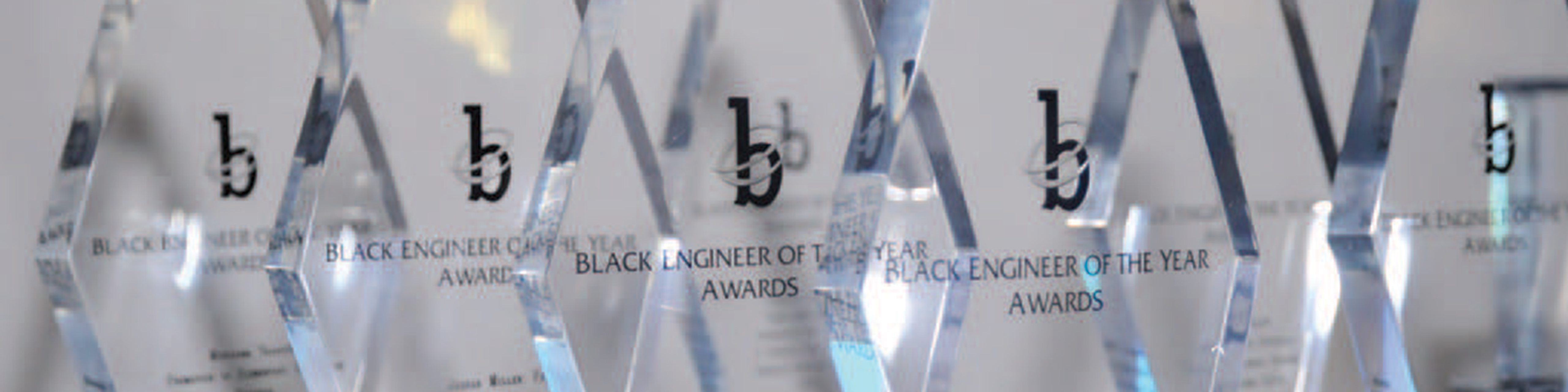 Row of Black Engineer of the Year Awards crystal trophies 