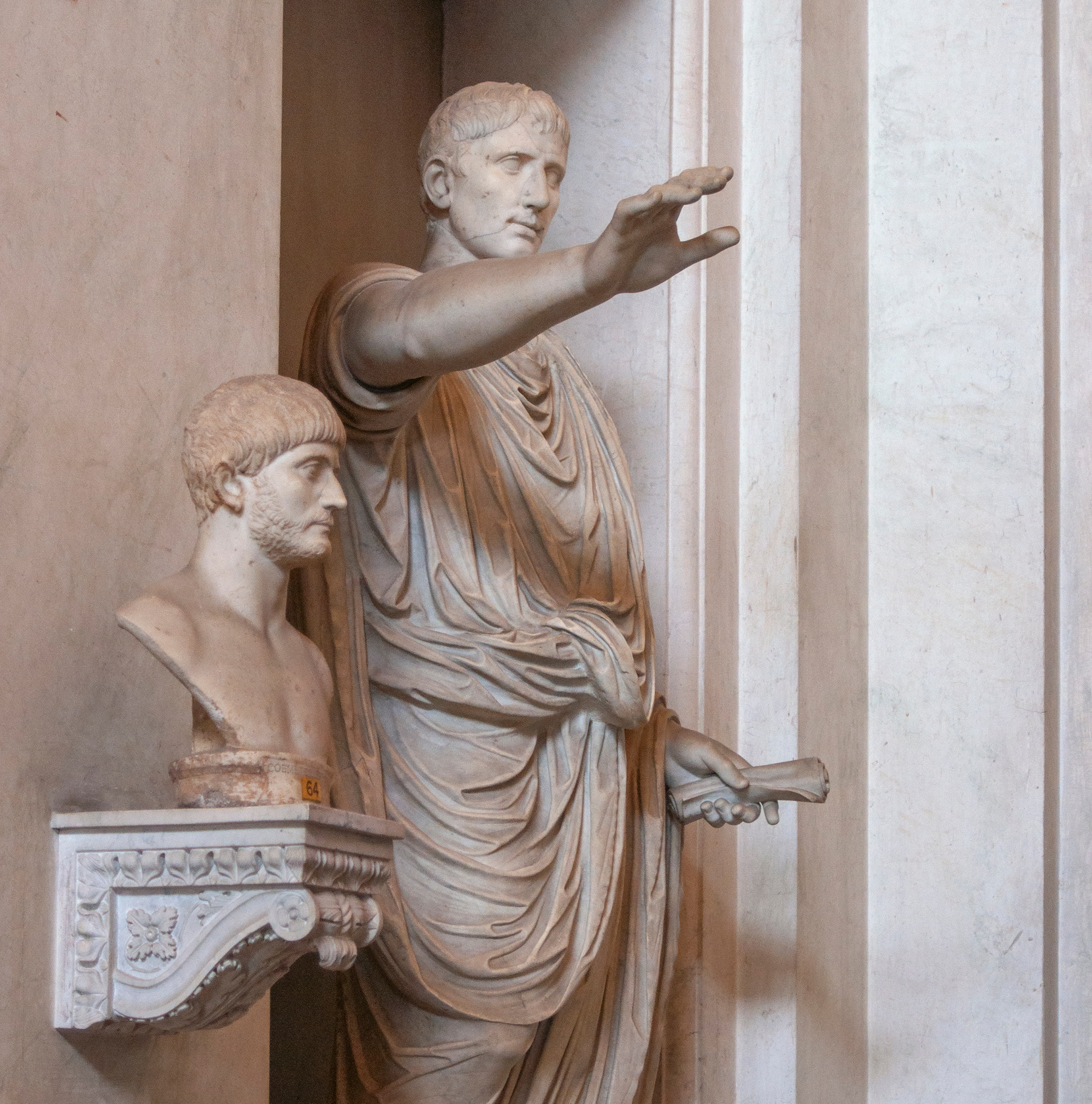 Statue of Julius Caesar pointing from a vestibule in a wall