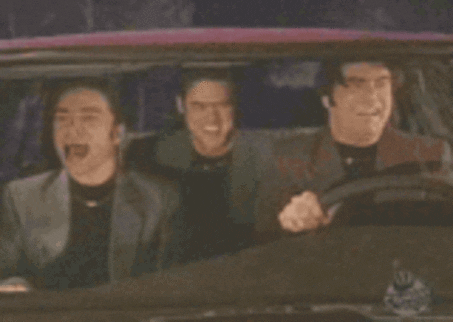 Animated gif of three men in a car moving their head side to side as they listen to a song