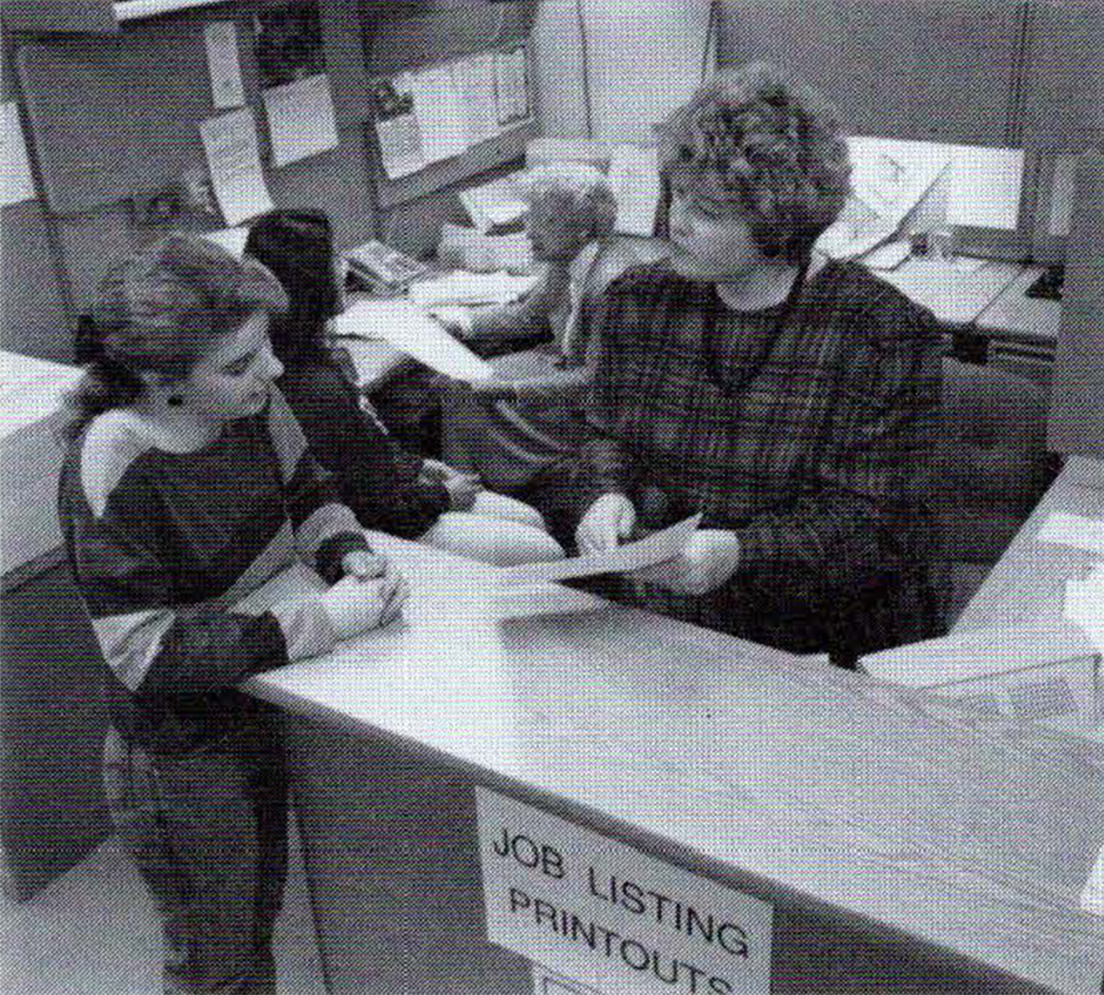 Black and white photo of a student working with a guidance counselor at a community college
