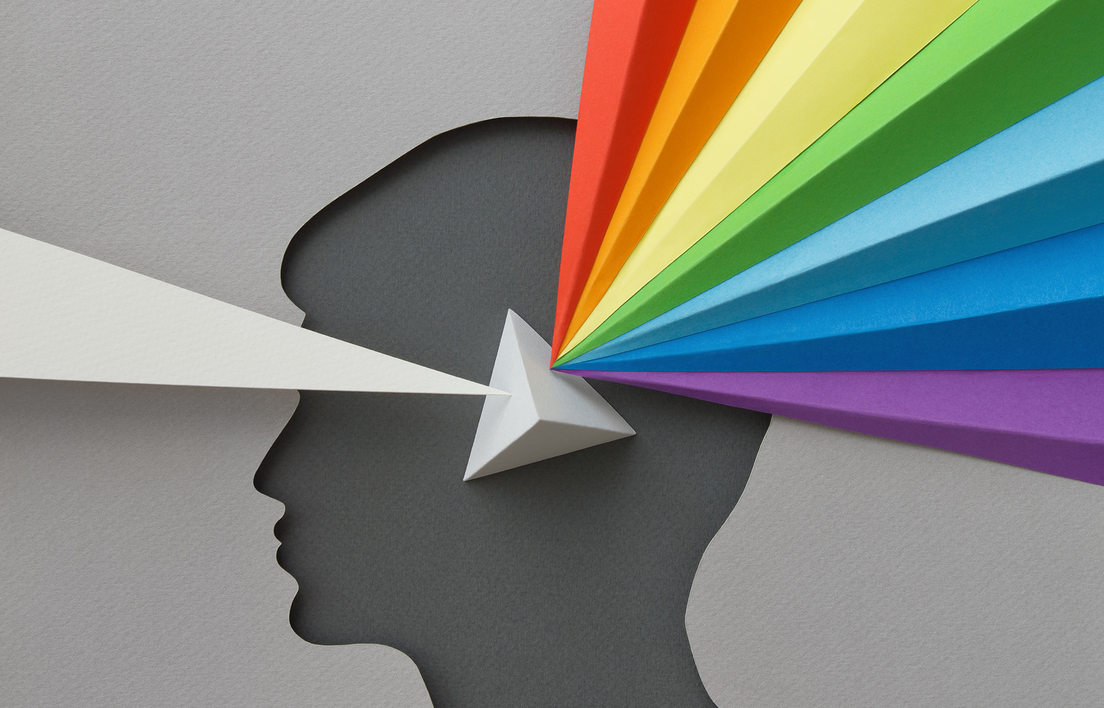 Paper head with rainbow and prism