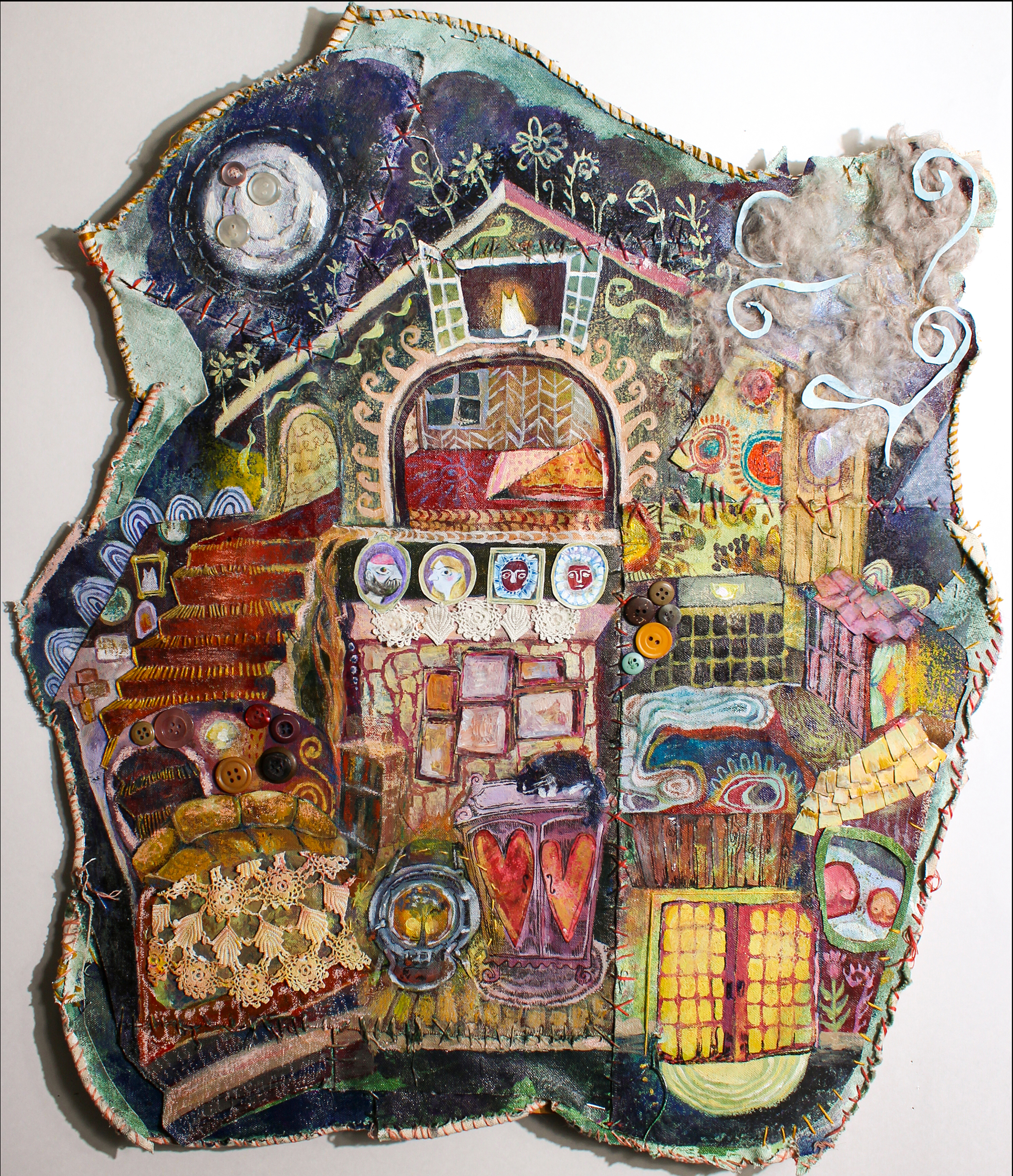 Photograph of a mixed-media collage in an abstract shape