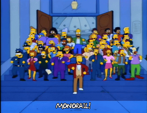 Animated gif of a group of people on a set of steps throwing up their hands and saying Monorail!