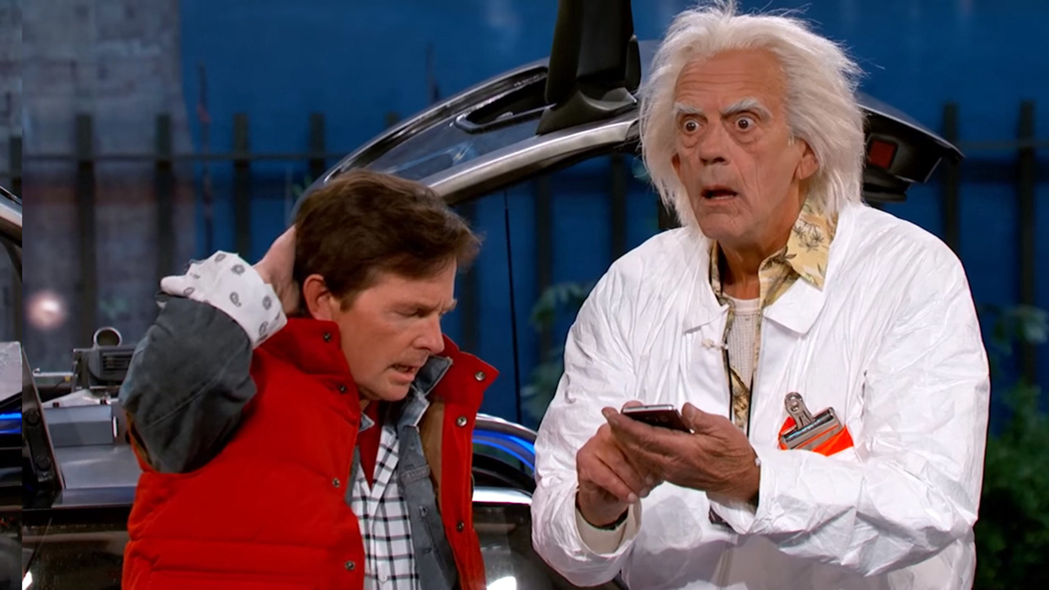 Michael J. Fox and Christopher Lloyd in costume as their characters from Back to the Future