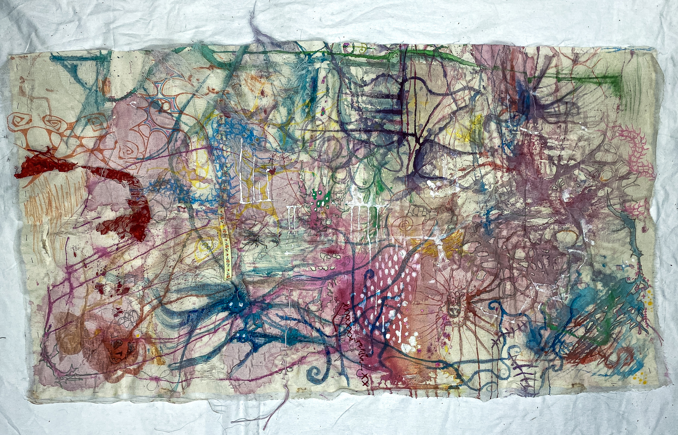 canvas with spidery forms created using fibrous materials, like yarn and thread