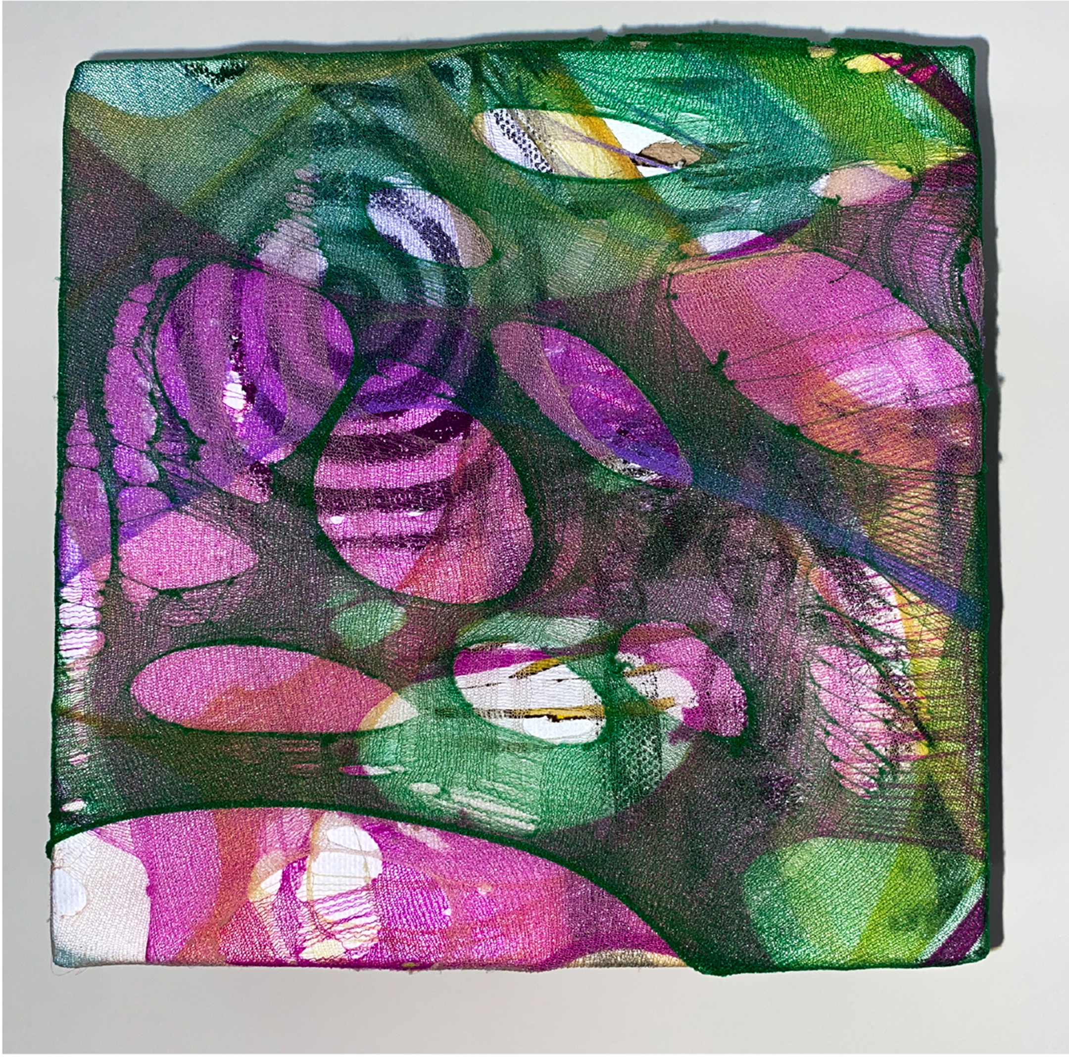 floral pattern created using colorful materials stretched on canvas